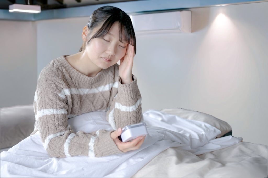 頭痛がひどい女性